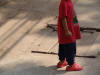 The Lao are very style conscious.  Here is a young man with some chic footwear that WE won't have for months.