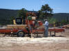 A real working little do it yourself sawmill in N.M.  Had to watch it for a spell