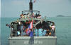 One could think this is overloaded, but it's a police boat so it can't be.  Yea, right!